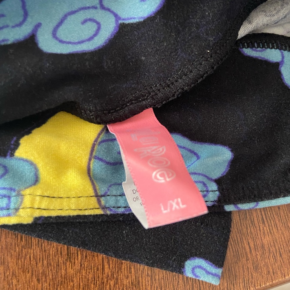 LLR kids - L / XL size leggings. Black background, clouds and thunderbolts